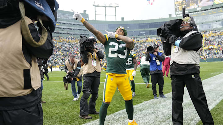 Oct 13, 2024; Green Bay, Wisconsin, USA;  Green Bay Packers cornerback Jaire Alexander (23) celebrates following the game against the Arizona Cardinals at Lambeau Field. Mandatory Credit: Jeff Hanisch-Imagn Images