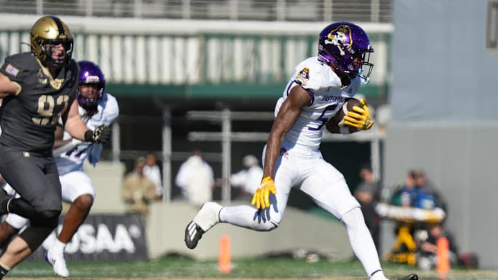 Oct 19, 2024; West Point, New York, USA; East Carolina Pirates wide receiver Chase Sowell (5) evades Army Black Knights defensive lineman Cody Winokur (93) on his way to a touchdown during the second half at Michie Stadium. Mandatory Credit: Lucas Boland-Imagn Images Oct 19, 2024; West Point, New York, USA; East Carolina Pirates wide receiver Chase Sowell (5) evades Army Black Knights defensive lineman Cody Winokur (93) on his way to a touchdown during the second half at Michie Stadium. Mandatory Credit: Lucas Boland-Imagn Images