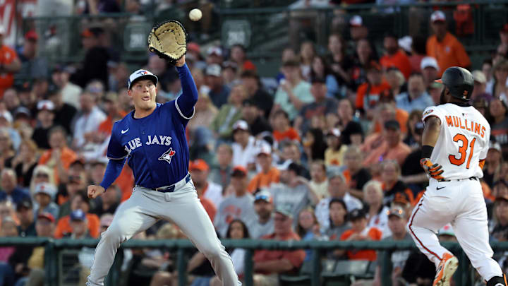 Toronto Blue Jays first baseman Will Wagner (7) awaits a throw on a ball hit by Baltimore Orioles outfielder Cedric Mullins (31) during the fifth inning at Ed Smith Stadium in Sarasota, Fla., on March 18, 2025.