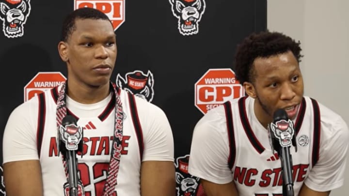Lubin (left) donned a red-and-black belt while seated next to Copeland (right) during the postgame press conference. 