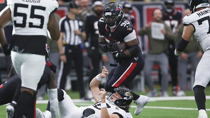 Nov 9, 2025; Houston, Texas, USA; Houston Texans defensive tackle Sheldon Rankins (90) intercepts a pass from Jacksonville Jaguars quarterback Trevor Lawrence (16) during the fourth quarter at NRG Stadium. Mandatory Credit: Troy Taormina-Imagn Images