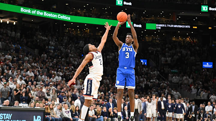 Nov 15, 2025; Boston, Massachusetts, USA; BYU Cougars forward AJ Dybantsa (3) shoots the ball over .UConn Huskies guard Silas Demary Jr. (2) during the second half at TD Garden. Mandatory Credit: Eric Canha-Imagn Images