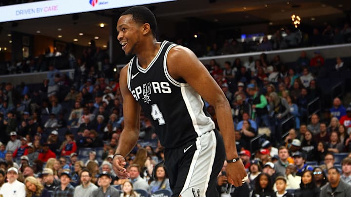 Mar 1, 2025; Memphis, Tennessee, USA; San Antonio Spurs guard De'Aaron Fox (4) reacts after a dunk during the third quarter against the Memphis Grizzlies at FedExForum. Mandatory Credit: Petre Thomas-Imagn Images