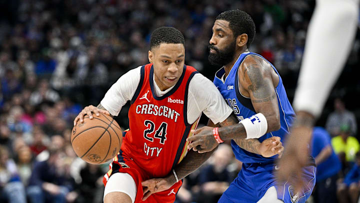 Jan 13, 2024; Dallas, Texas, USA; New Orleans Pelicans guard Jordan Hawkins (24) drives to the basket past Dallas Mavericks guard Kyrie Irving (11) during the second half at the American Airlines Center. Jan 13, 2024; Dallas, Texas, USA; New Orleans Pelicans guard Jordan Hawkins (24) drives to the basket past Dallas Mavericks guard Kyrie Irving (11) during the second half at the American Airlines Center.
