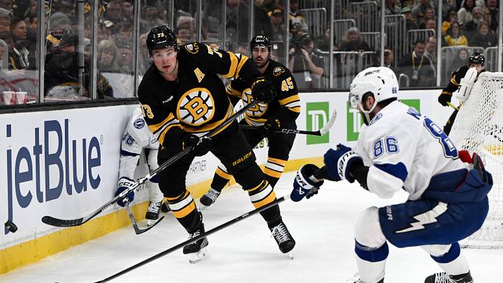 Apr 11, 2026; Boston, Massachusetts, USA; Boston Bruins defenseman Charlie McAvoy (73) passes the puck against Tampa Bay Lightning right wing Nikita Kucherov (86) during the second period at the TD Garden. Mandatory Credit: Brian Fluharty-Imagn Images