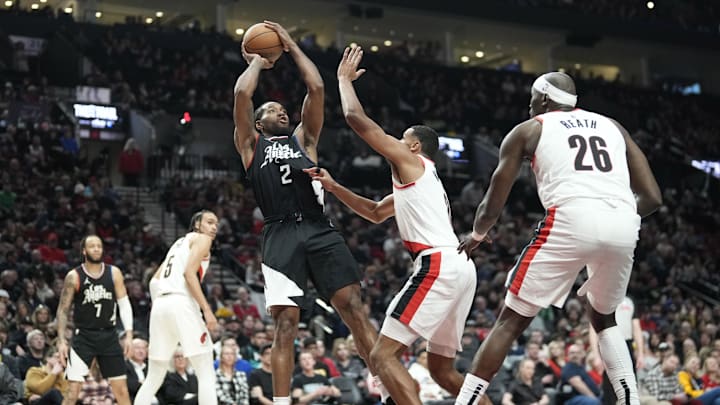 Mar 22, 2024; Portland, Oregon, USA; LA Clippers small forward Kawhi Leonard (2) shoots the ball over Portland Trail Blazers forward Kris Murray (8, right) during the second half at Moda Center. Mandatory Credit: Soobum Im-Imagn Images