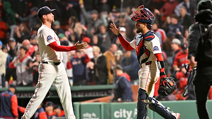 Apr 6, 2025; Boston, Massachusetts, USA; Boston Red Sox catcher Carlos Narvaez (75) and relief pitcher Cooper Criswell (64) celebrate defeating the St. Louis Cardinals at Fenway Park. Mandatory Credit: Eric Canha-Imagn Images