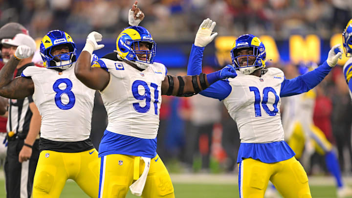 Nov 23, 2025; Inglewood, California, USA; Los Angeles Rams linebacker Jared Verse (8),  defensive end Kobie Turner (91) and linebacker Josaiah Stewart (10) celebrate after a sack of Tampa Bay Buccaneers quarterback Baker Mayfield (6) in the first half at SoFi Stadium. Mandatory Credit: Jayne Kamin-Oncea-Imagn Images
