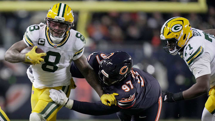 Green Bay Packers running back Josh Jacobs (8) is tackled by Chicago Bears defensive tackle Andrew Billings (97) during the second quarter of their wild card playoff game Saturday, January 10, 2026 at Soldier Field in Chicago, Illinois.