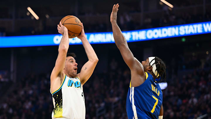 Dec 23, 2024; San Francisco, California, USA; Indiana Pacers guard T.J. McConnell (9) shoots over Golden State Warriors guard Buddy Hield (7) in the first quarter at Chase Center. Mandatory Credit: Eakin Howard-Imagn Images