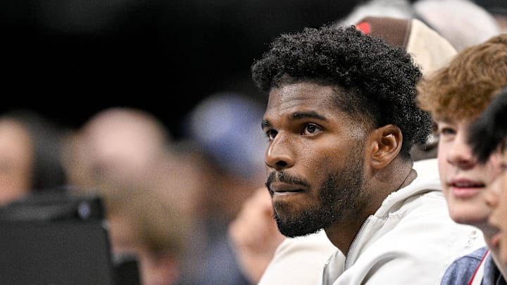 Jan 14, 2025; Dallas, Texas, USA; Colorado Buffaloes quarterback Shedeur Sanders looks on during the game between the Dallas Mavericks and the Denver Nuggets in the second quarter at the American Airlines Center. Mandatory Credit: Jerome Miron-Imagn Images Jan 14, 2025; Dallas, Texas, USA; Colorado Buffaloes quarterback Shedeur Sanders looks on during the game between the Dallas Mavericks and the Denver Nuggets in the second quarter at the American Airlines Center. Mandatory Credit: Jerome Miron-Imagn Images