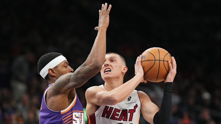 Nov 6, 2024; Phoenix, Arizona, USA; Miami Heat guard Tyler Herro (14) drives against Phoenix Suns guard Bradley Beal (3) during the second half at Footprint Center. Mandatory Credit: Joe Camporeale-Imagn Images