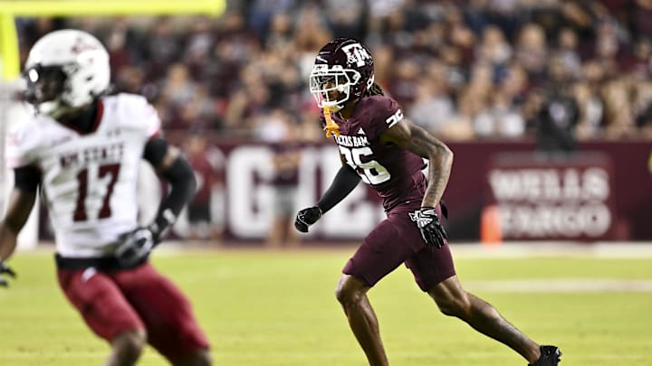 Nov 16, 2024; College Station, Texas, USA; Texas A&M Aggies defensive back Will Lee III (26) defends in coverage against the New Mexico State Aggies during the first half at Kyle Field. Mandatory Credit: Maria Lysaker-Imagn Images 