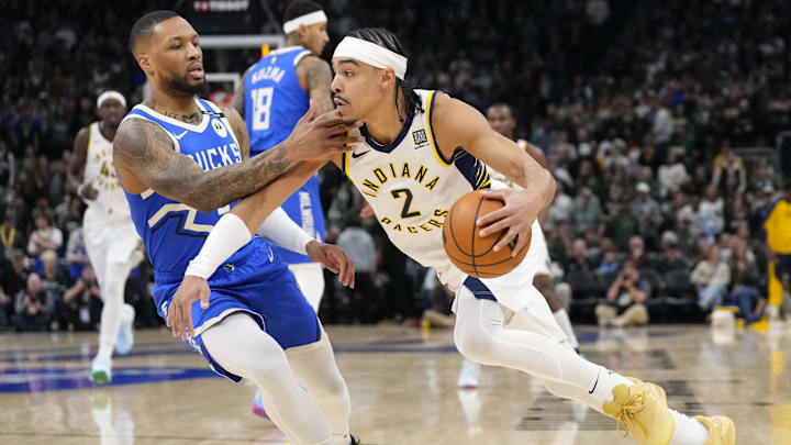 Mar 15, 2025; Milwaukee, Wisconsin, USA; Indiana Pacers guard Andrew Nembhard (2) drives for the basket against Milwaukee Bucks guard Damian Lillard (0) during the first quarter at Fiserv Forum. Mandatory Credit: Jeff Hanisch-Imagn Images Mar 15, 2025; Milwaukee, Wisconsin, USA; Indiana Pacers guard Andrew Nembhard (2) drives for the basket against Milwaukee Bucks guard Damian Lillard (0) during the first quarter at Fiserv Forum. Mandatory Credit: Jeff Hanisch-Imagn Images