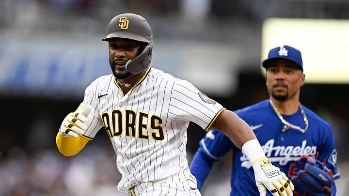 Jun 27, 2026; San Diego, California, USA; San Diego Padres designated hitter Miguel Andujar (41) is caught in a run down by Los Angeles Dodgers shortstop Mookie Betts (50) during the third inning at Petco Park. Andujar was tagged out on the play. Mandatory Credit: Denis Poroy-Imagn Images