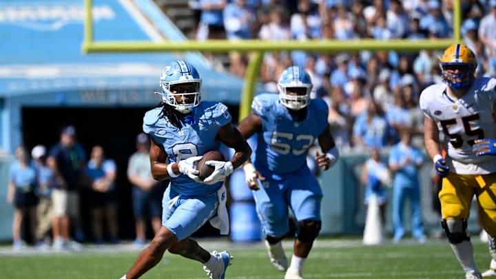 Oct 5, 2024; Chapel Hill, North Carolina, USA; North Carolina Tar Heels wide receiver Kobe Paysour (8) with the ball in the second quarter at Kenan Memorial Stadium. Mandatory Credit: Bob Donnan-Imagn Images Oct 5, 2024; Chapel Hill, North Carolina, USA; North Carolina Tar Heels wide receiver Kobe Paysour (8) with the ball in the second quarter at Kenan Memorial Stadium. Mandatory Credit: Bob Donnan-Imagn Images