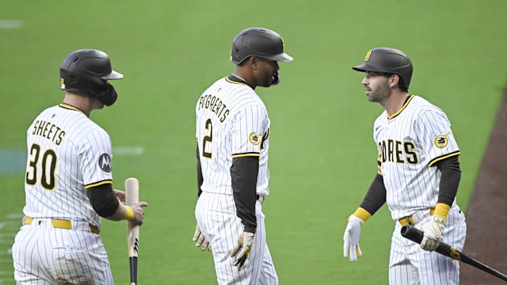 Apr 29, 2025; San Diego, California, USA; San Diego Padres shortstop Xander Bogaerts (2) is congratulated by  Gavin Sheets (30) and Tyler Wade (14) after scoring during the first inning against the San Francisco Giants at Petco Park. Mandatory Credit: Denis Poroy-Imagn Images