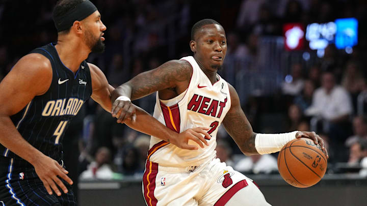 Miami Heat guard Terry Rozier (2) drives past Orlando Magic guard Jalen Suggs (4) during the first half at Kaseya Center.