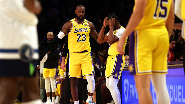 Oct 22, 2024; Los Angeles, California, USA; Los Angeles Lakers forward LeBron James (23) checks into the game with his son, guard Bronny James (9) during the second quarter against the Minnesota Timberwolves at Crypto.com Arena. This marked the first time in NBA history that a father and son played together. Mandatory Credit: Jason Parkhurst-Imagn Images Oct 22, 2024; Los Angeles, California, USA; Los Angeles Lakers forward LeBron James (23) checks into the game with his son, guard Bronny James (9) during the second quarter against the Minnesota Timberwolves at Crypto.com Arena. This marked the first time in NBA history that a father and son played together. Mandatory Credit: Jason Parkhurst-Imagn Images