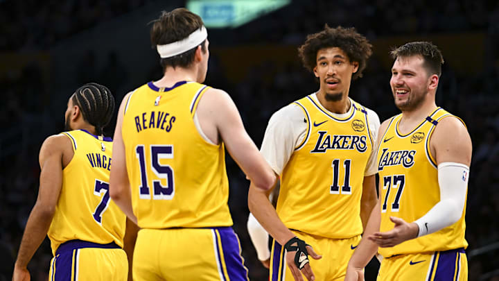 Apr 11, 2025; Los Angeles, California, USA; Los Angeles Lakers guard Luka Doncic (77) celebrates with center Jaxson Hayes (11), and guard Austin Reaves (15) after scoring against the Houston Rockets during the first half at Crypto.com Arena. Mandatory Credit: Jonathan Hui-Imagn Images