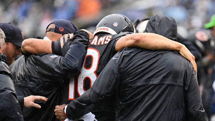 Sep 20, 2026; Chicago, Illinois, USA; Chicago Bears quarterback Caleb Williams (18) is helped off the field with an apparent injury against the Minnesota Vikings during the second half at Soldier Field. Sep 20, 2026; Chicago, Illinois, USA; Chicago Bears quarterback Caleb Williams (18) is helped off the field with an apparent injury against the Minnesota Vikings during the second half at Soldier Field.