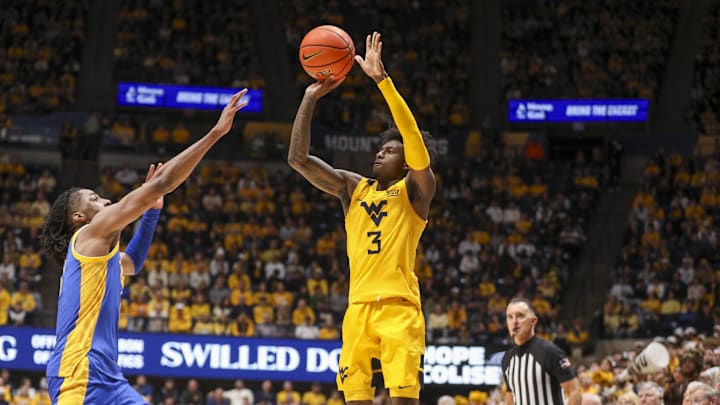 Nov 13, 2025; Morgantown, West Virginia, USA; West Virginia Mountaineers guard Honor Huff (3) shoots a three pointer over Pittsburgh Panthers guard Omari Witherspoon (8) during the second half at WVU Coliseum. Mandatory Credit: Ben Queen-Imagn Images