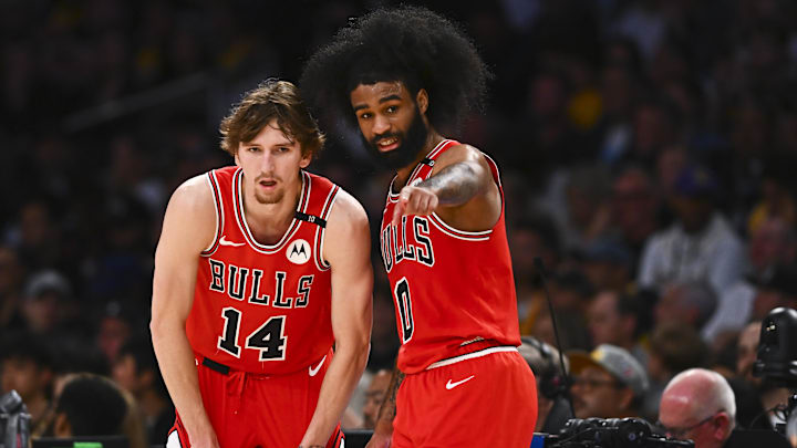 Mar 22, 2025; Los Angeles, California, USA; Chicago Bulls guard Coby White (0) points with Chicago Bulls forward Matas Buzelis (14) against the Los Angeles Lakers during the second half at Crypto.com Arena. Mandatory Credit: Jonathan Hui-Imagn Images