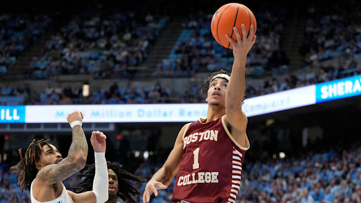 Jan 25, 2025; Chapel Hill, North Carolina, USA;  Boston College Eagles guard Dion Brown (1) shoots as North Carolina Tar Heels guard RJ Davis (4) defends in the first half at Dean E. Smith Center. Mandatory Credit: Bob Donnan-Imagn Images