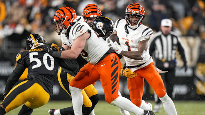 Jan 4, 2025; Pittsburgh, Pennsylvania, USA; Cincinnati Bengals wide receiver Ja'Marr Chase (1) runs with a catch against the Pittsburgh Steelers in the fourth quarter at Acrisure Stadium. The Bengals won 19-17 to finish the regular season at 9-8. Mandatory Credit: Sam Greene/USA TODAY Network via Imagn Images