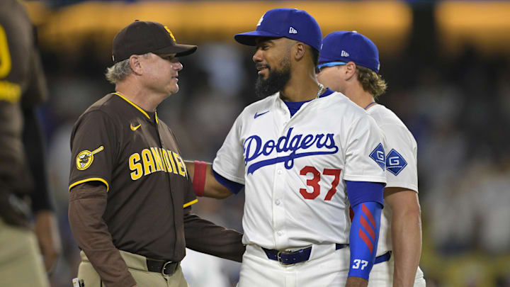 Jun 19, 2025; San Diego Padres manager Mike Shildt (8) talks with Los Angeles Dodgers right fielder Teoscar Hernandez (37) as play is about to resume after benches cleared in the eighth inning at Dodger Stadium. Mandatory Credit: Jayne Kamin-Oncea-Imagn Images