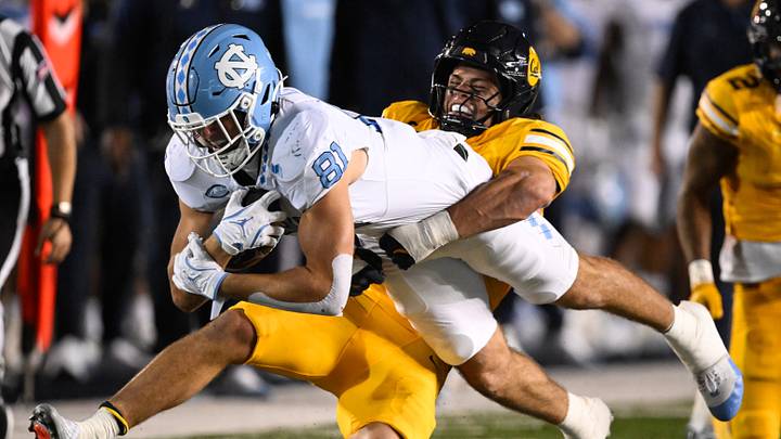 Oct 17, 2025; Berkeley, California, USA; North Carolina Tar Heels tight end Connor Cox (81) gets tackled by California Golden Bears linebacker Cade Uluave (0) in the second quarter at California Memorial Stadium. Mandatory Credit: Eakin Howard-Imagn Images Oct 17, 2025; Berkeley, California, USA; North Carolina Tar Heels tight end Connor Cox (81) gets tackled by California Golden Bears linebacker Cade Uluave (0) in the second quarter at California Memorial Stadium. Mandatory Credit: Eakin Howard-Imagn Images