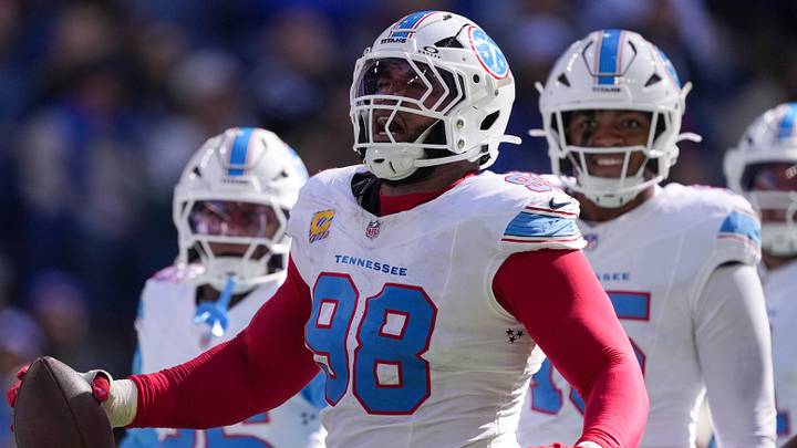 Tennessee Titans defensive tackle Jeffery Simmons (98) causes and recovers a fumble Sunday, Oct. 18, 2026, by Indianapolis Colts running back Jonathan Taylor (28) at Lucas Oil Stadium in Indianapolis.