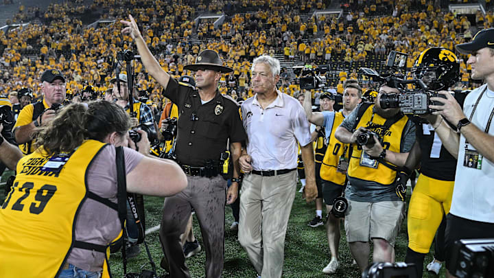 Sep 13, 2025; Iowa City, Iowa, USA; Iowa Hawkeyes head coach Kirk Ferentz walks to midfield after the game against the Massachusetts Minutemen at Kinnick Stadium. Ferentz finished the game with the most all-time wins in the Big Ten Conference surpassing Woody Hayes with 206 Big Ten wins. Mandatory Credit: Jeffrey Becker-Imagn Images Sep 13, 2025; Iowa City, Iowa, USA; Iowa Hawkeyes head coach Kirk Ferentz walks to midfield after the game against the Massachusetts Minutemen at Kinnick Stadium. Ferentz finished the game with the most all-time wins in the Big Ten Conference surpassing Woody Hayes with 206 Big Ten wins. Mandatory Credit: Jeffrey Becker-Imagn Images