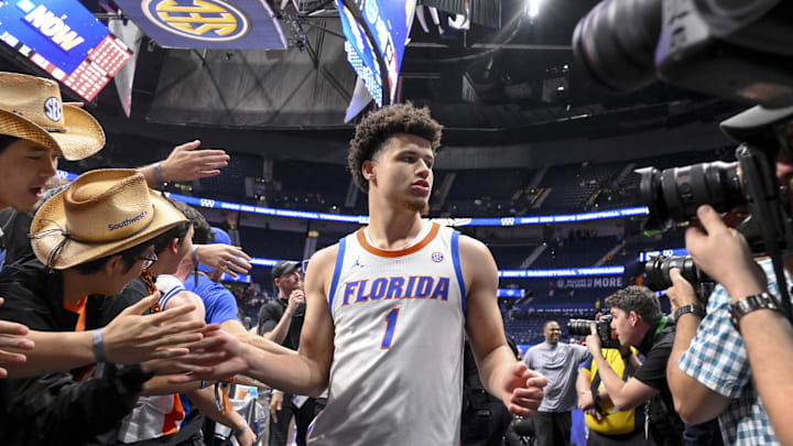Mar 15, 2025; Nashville, TN, USA;  Florida Gators guard Walter Clayton Jr. (1) slaps hands with fans after the win against the Alabama Crimson Tide during the second half at Bridgestone Arena. Mandatory Credit: Steve Roberts-Imagn Images