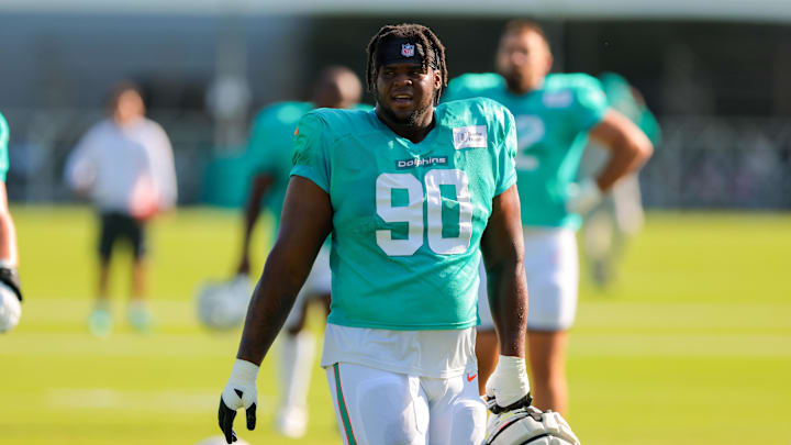 Miami Dolphins defensive tackle Kenneth Grant (90) looks on from the field during training camp at Baptist Health Training Complex. Miami Dolphins defensive tackle Kenneth Grant (90) looks on from the field during training camp at Baptist Health Training Complex.