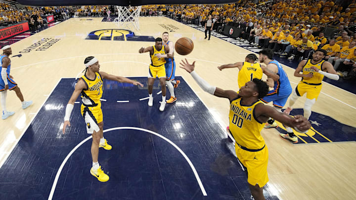 Jun 11, 2025; Indianapolis, Indiana, USA; Indiana Pacers guard Bennedict Mathurin (00) reaches for the ball against the Oklahoma City Thunder during the second half during game three of the 2025 NBA Finals at Gainbridge Fieldhouse. Mandatory Credit: Kyle Terada-Imagn Images