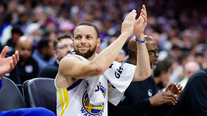 Golden State Warriors guard Stephen Curry (30) claps from the bench. Golden State Warriors guard Stephen Curry (30) claps from the bench.