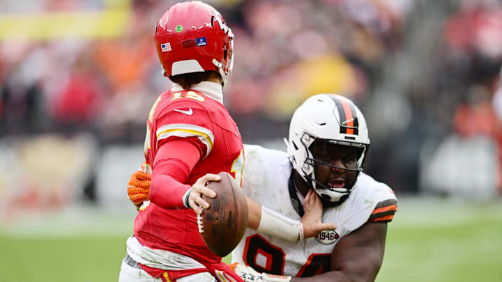 Dec 15, 2024; Cleveland, Ohio, USA; Cleveland Browns defensive tackle Dalvin Tomlinson (94) pressures Kansas City Chiefs quarterback Patrick Mahomes (15) during the second half at Huntington Bank Field. Mandatory Credit: Ken Blaze-Imagn Images