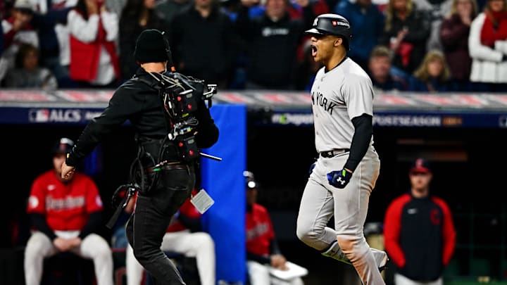 Oct 19, 2024; Cleveland, Ohio, USA; New York Yankees outfielder Juan Soto (22) crosses home plate after hitting a three run home run during the tenth inning against the Cleveland Guardians during game five of the ALCS for the 2024 MLB playoffs at Progressive Field. Mandatory Credit: David Dermer-Imagn Images