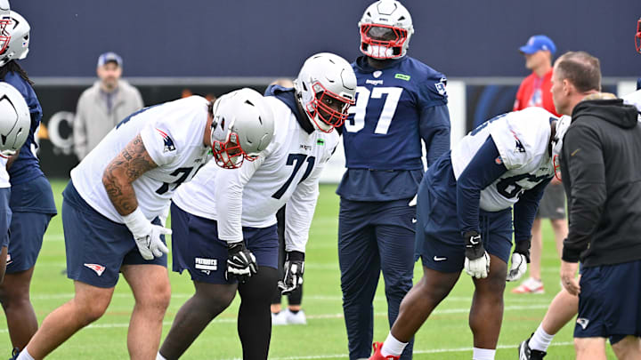 Jun 9, 2025; Foxborough, MA, USA; New England Patriots offensive tackle Mike Onwenu (71) lines up for a drill during minicamp at Gillette Stadium. Mandatory Credit: Eric Canha-Imagn Images