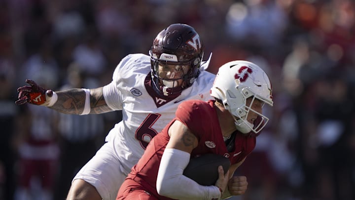 Oct 5, 2024; Stanford, California, USA;  Virginia Tech Hokies defensive lineman Josh Fuga (6) sacks Stanford Cardinal quarterback Justin Lamson (8) during the fourth quarter at Stanford Stadium. Mandatory Credit: Stan Szeto-Imagn Images