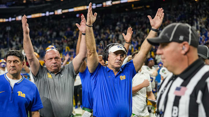 Pittsburgh Panthers head coach Pat Narduzzi lifts his hands up signaling touchdown after Pittsburgh Panthers quarterback Julian Dugger’s touchdown came under review during one of the six overtimes of the 2024 GameAbove Sports Bowl at Ford Field in Detroit, Thursday, Dec. 26, 2024.
