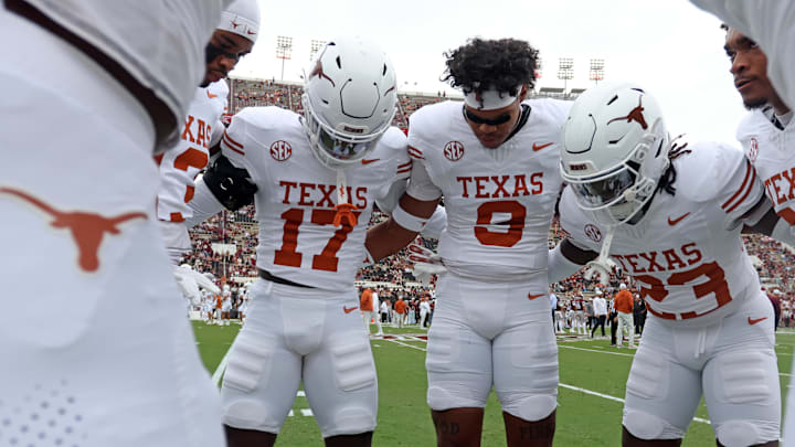 Oct 25, 2025; Starkville, Mississippi, USA; Texas Longhorns defensive backs Xavier Filsaime (17), Jonah Williams (9) and Jordon Johnson-Rubell (23) huddle up during warm ups prior to the game against the Mississippi State Bulldogs at Davis Wade Stadium at Scott Field. Mandatory Credit: Petre Thomas-Imagn Images