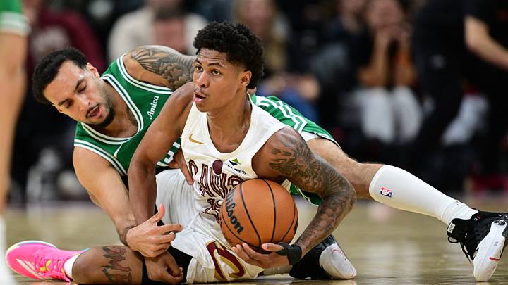 Oct 8, 2026; Cleveland, Ohio, USA;  Cleveland Cavaliers guard Meleek Thomas (15) protects the ball from Boston Celtics guard Devin Carter (99) during the second half of a preseason game at Rocket Arena.  Mandatory Credit: David Dermer-Imagn Images