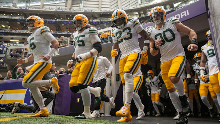 Green Bay Packers quarterback Clayton Tune (6), Green Bay Packers guard Sean Rhyan (75), running back Emanuel Wilson (23) and defensive end Lukas van Ness (90) take to the field before their game Sunday, January 4, 2026 at U.S. Bank Stadium in Minneapolis, Minnesota. The Minnesota Vikings beat the Green Bay Packers 16-3.