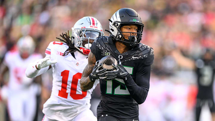 Oct 12, 2024; Eugene, Oregon, USA; Oregon Ducks wide receiver Tez Johnson (15) makes a catch for a touchdown during the second quarter against the Ohio State Buckeyes at Autzen Stadium.
