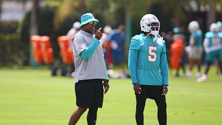 Jun 4, 2024; Miami Gardens, FL, USA; Miami Dolphins defensive coordinator Anthony Weaver talks to cornerback Jalen Ramsey (5) during mandatory minicamp at Baptist Health Training Complex. Mandatory Credit: Sam Navarro-USA TODAY Sports