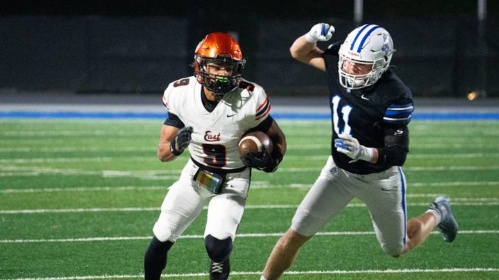 Sioux City East's Chris Ford runs the ball against Waukee Northwest's Brady Fitz during 5A playoff football game at Waukee Northwest High School on Friday, Nov. 7, 2025, in Waukee.