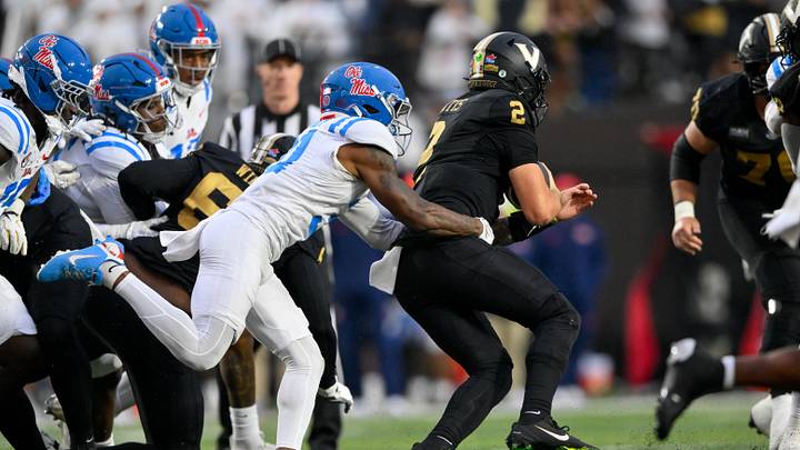 Oct 10, 2026; Nashville, Tennessee, USA; Mississippi Rebels safety Ladarian Clardy (31) tackles Vanderbilt Commodores quarterback Jared Curtis (2) from behind during the second half at FirstBank Stadium. Mandatory Credit: Steve Roberts-Imagn Images Oct 10, 2026; Nashville, Tennessee, USA; Mississippi Rebels safety Ladarian Clardy (31) tackles Vanderbilt Commodores quarterback Jared Curtis (2) from behind during the second half at FirstBank Stadium. Mandatory Credit: Steve Roberts-Imagn Images