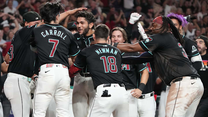 Aug 9, 2024; Phoenix, Arizona, USA; Arizona Diamondbacks catcher Adrian Del Castillo (25) celebrates with teammates after hitting a walk off solo home run against the Philadelphia Phillies in the ninth inning at Chase Field. Mandatory Credit: Rick Scuteri-Imagn Images